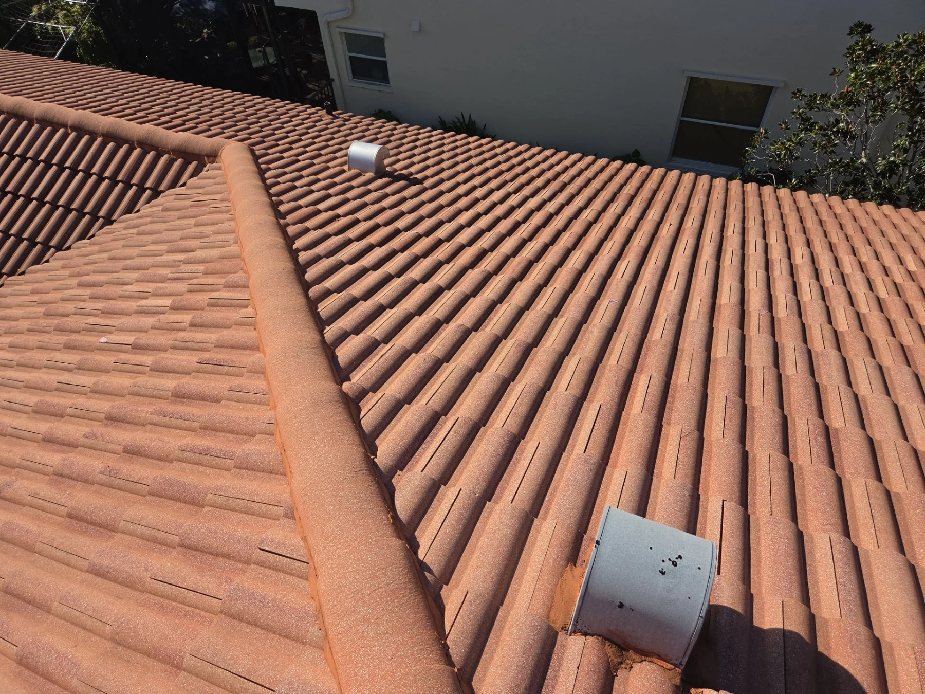 KLR job photo: tile roof hips, field tiles and vents at the Work Residence